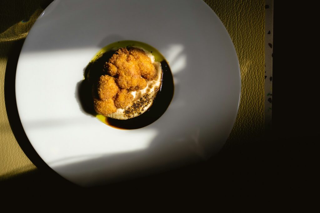 A white plate topped with food on top of a table